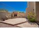 Backyard featuring a brick fireplace and stone patio, perfect for entertaining at 8149 N 13Th Pl, Phoenix, AZ 85020
