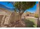Backyard with mature trees, brick fireplace and rock landscaping at 8149 N 13Th Pl, Phoenix, AZ 85020
