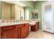 Bathroom with tile floors, a vanity with mirror, and a green-themed color scheme at 8149 N 13Th Pl, Phoenix, AZ 85020