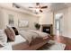 Comfortable bedroom featuring a fireplace, ceiling fan, and access to the rest of the home at 8149 N 13Th Pl, Phoenix, AZ 85020