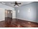 Large bedroom with wood floors and light blue walls featuring recessed lighting and two small windows at 8149 N 13Th Pl, Phoenix, AZ 85020