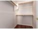 Walk-in closet with wood floors, white walls, wood racks and shelving at 8149 N 13Th Pl, Phoenix, AZ 85020