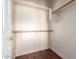 Walk-in closet with wood floors, white walls, and wood racks and shelving at 8149 N 13Th Pl, Phoenix, AZ 85020
