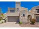 Beautiful home featuring desert landscaping, a two-car garage, and unique architectural details at 8149 N 13Th Pl, Phoenix, AZ 85020