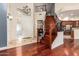 Grand foyer with a staircase, hardwood floors, and decorative chandelier, offering a warm welcome at 8149 N 13Th Pl, Phoenix, AZ 85020