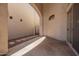 Private outdoor living space featuring a stone patio with decorative rock landscaping at 8149 N 13Th Pl, Phoenix, AZ 85020