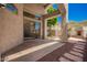Covered patio with stone flooring, fireplace and view of low maintenance yard at 8149 N 13Th Pl, Phoenix, AZ 85020