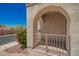 Covered front porch with an archway and decorative gate provides a welcoming entrance at 8149 N 13Th Pl, Phoenix, AZ 85020