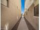 Walkway on side of home with brick pavers and desert landscaping at 8149 N 13Th Pl, Phoenix, AZ 85020