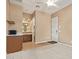 Bonus room that features a kitchenette, bathroom and an exit to the outside at 815 W Juniper Ln, Litchfield Park, AZ 85340