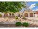 Charming single-story home featuring a private two-car garage and tasteful desert landscaping in a well-maintained community at 815 W Juniper Ln, Litchfield Park, AZ 85340
