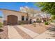 Beautiful single-story home boasts a private garage, xeriscaped front yard, and a paved driveway, blending charm and low-maintenance living at 815 W Juniper Ln, Litchfield Park, AZ 85340