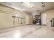 Spacious three car garage with ample storage and two garage door openers for convenience at 815 W Juniper Ln, Litchfield Park, AZ 85340