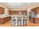Spacious kitchen with a large island, counter seating, stainless steel appliances, and ample cabinet space at 815 W Juniper Ln, Litchfield Park, AZ 85340