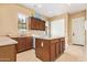 Well-organized laundry room featuring abundant cabinetry, a countertop island, and modern washer and dryer units at 815 W Juniper Ln, Litchfield Park, AZ 85340
