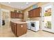 Practical laundry room features ample storage, a sink, and modern appliances, providing a functional and efficient space at 815 W Juniper Ln, Litchfield Park, AZ 85340