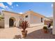 Charming brick patio features a cozy seating area, decorative potted plants, and a welcoming ambiance, perfect for relaxing outdoors at 815 W Juniper Ln, Litchfield Park, AZ 85340