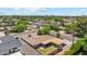 Aerial view of the neighborhood showcases a charming house with mature trees at 8202 E Coolidge St, Scottsdale, AZ 85251
