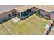 Aerial view of the backyard with a covered patio, grill, and a well-maintained lawn at 8202 E Coolidge St, Scottsdale, AZ 85251