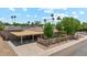 Property featuring a covered carport, driveway, and manicured landscaping at 8202 E Coolidge St, Scottsdale, AZ 85251