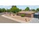 View of a property featuring desert landscaping and a private gated front yard at 8202 E Coolidge St, Scottsdale, AZ 85251
