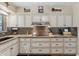 Stylish kitchen featuring granite countertops, a decorative backsplash, and plenty of storage at 8202 E Coolidge St, Scottsdale, AZ 85251