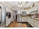 Well-lit kitchen features stainless steel appliances, granite countertops, and ample cabinet space at 8202 E Coolidge St, Scottsdale, AZ 85251