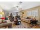 Spacious living room with hardwood floors, ceiling fan, and ample natural light at 8202 E Coolidge St, Scottsdale, AZ 85251