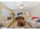 Bright and airy living room with a ceiling fan and comfortable sofas, perfect for relaxing at 8202 E Coolidge St, Scottsdale, AZ 85251
