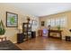 Welcoming living room boasts wood floors, neutral walls, and decor with a casual ambiance at 8202 E Coolidge St, Scottsdale, AZ 85251