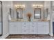A bathroom features a double sink vanity and a decorative vase in the middle at 8654 W Melinda Ln, Peoria, AZ 85382