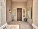 Welcoming front porch with a decorative metal door and tiled flooring at 8654 W Melinda Ln, Peoria, AZ 85382