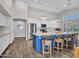 Spacious kitchen with large island, stainless steel appliances, and seating for three at 8654 W Melinda Ln, Peoria, AZ 85382