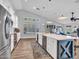 Bright, modern kitchen with a large island, stainless steel appliances, and white cabinetry at 8654 W Melinda Ln, Peoria, AZ 85382