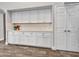 Bright kitchen featuring white cabinets, quartz countertops, and ample storage at 8654 W Melinda Ln, Peoria, AZ 85382