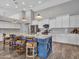 Bright kitchen featuring a large island with counter seating and modern stainless steel appliances at 8654 W Melinda Ln, Peoria, AZ 85382