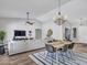 Open living space with dining area, modern furnishings, and ample natural light at 8654 W Melinda Ln, Peoria, AZ 85382