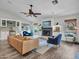 Cozy living room with shiplap accent wall, fireplace, and comfortable seating at 8654 W Melinda Ln, Peoria, AZ 85382