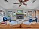 Bright living room features a fireplace, ceiling fan, and stylish decor, creating a welcoming atmosphere at 8654 W Melinda Ln, Peoria, AZ 85382