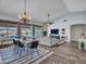Open concept living space with dining area, comfortable seating, and backyard views at 8654 W Melinda Ln, Peoria, AZ 85382