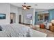 Large primary bedroom with sliding glass doors to a covered patio and neutral color palette at 8654 W Melinda Ln, Peoria, AZ 85382