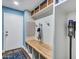 Mud room features hooks, a bench, and upper shelving for storage at 8654 W Melinda Ln, Peoria, AZ 85382