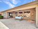 Outdoor patio with a seating area, offering a comfortable space for gatherings and enjoying the backyard view at 8654 W Melinda Ln, Peoria, AZ 85382