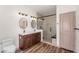 Modern bathroom featuring double vanity, quartz countertops, and a glass walk-in shower at 951 E Jacob St, Chandler, AZ 85225