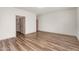 Bedroom with neutral tones, wood-style flooring, and multiple doorways at 951 E Jacob St, Chandler, AZ 85225