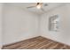 Well-lit bedroom with ceiling fan, natural light, and wood-style flooring at 951 E Jacob St, Chandler, AZ 85225