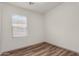 Bedroom with neutral walls, wood-look floors, and bright natural light at 951 E Jacob St, Chandler, AZ 85225