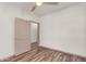 Neutral bedroom with modern ceiling fan, wood-style flooring, and natural light at 951 E Jacob St, Chandler, AZ 85225
