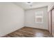 Clean bedroom with wood-style floors, bright natural light, and a sliding closet door at 951 E Jacob St, Chandler, AZ 85225
