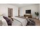 Spacious bedroom featuring hardwood flooring, soft lighting, and stylish decor for a relaxing ambiance at 951 E Jacob St, Chandler, AZ 85225